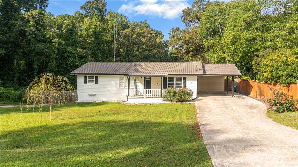 Welcome home! This cozy 4-bedroom, 2-bath ranch home offers the perfect blend of comfort and convenience in a top-rated Georgia school district. Step inside to find a bright, open layout with a spacious family room, dining area, and an updated kitchen—ideal for both everyday living and entertaining.
Outside, you’ll find the features that make this home truly special: two driveways with tons of parking space—perfect for work trucks, trailers, or extra vehicles—plus a large backyard with a cozy fire pit for evenings under the stars. The ranch-style design means everything you need is on one level, making it easy to enjoy and maintain.
Whether you’re looking for space for your family, your work, or simply a home that feels warm and welcoming, this one has it all. Make an appointment today!