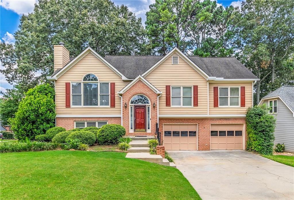 WOW WOW WOW SUCH A BEAUTIFUL 2282 SF HOME WITH 5 BEDROOMS AND 3 FULL BATHS WITH THE FINISHED BASEMENT IN A CORNER, PRIVATE LOT AND IN QUIET, HIGHLY SOUGHT AFTER, AWARD WINNING NEIGHBORHOOD OF DEER RUN IN WOODSTOCK, GA. This wonderful home situates on a beautiful spacious corner lot of 0.21 acres of a relatively level front and back yard. Upon entering the property, you will see a large super long level driveway and a two car garage. Upon entering the home, you will see a large inviting family room with the fireplace. This beautiful family room with the soaring vaulted ceiling that is filled with natural light from three big windows. Following is the formal dining room with the open concept. The kitchen offers the breakfast area, the walk-in pantry, the gleaming GRANITE countertop, one big stainless steel sink, the newer gas stove and oven, the stainless steel dishwasher, the white cabinets, the disposal, the microwave and the stainless steel fridge. The kitchen and the formal dining offer a beautiful wooded view to the backyard. Most of the flooring areas upstairs are made of real hard-wood, as well. Fall in love with the lovely deck in the serene backyard oasis. There are a coat closet and a linen closet on this level. The owner's suite is spacious with the tray ceiling and two big windows and a huge walk-in closet. The owner's bath features the double sinks, the bathroom mirror, the UPDATED brand new vanity, the BRAND NEW toilet seat, the separate bathtub and the standing shower. The flooring in the owner's bathroom is brand-new and made of beautiful tiles. The bathroom in the hallway upstairs features the UPGRADED new vanity and the BRAND NEW tile floor. The two other bedrooms are spacious with many windows for natural light. All the staircases were just replaced with BRAND NEW HARDWOOD. THE BASEMENT IS FINISHED WITH TWO BEDROOMS, ONE FULL BATHROOM, ONE SMALL KITCHENETTE AND A WASHING ROOM AREA. The entire BASEMENT WAS JUST REPLACED WITH THE BRAND NEW LVP FLOORING. There is also a built-in small kitchenette in the basement. The basement kitchenette includes an electric stove, a sink, a dishwasher and some kitchen cabinets. The basement has a door to the backyard. And the backyard has a gate to the outside. THE INTERIOR OF THE HOME WAS JUST PAINTED FRESH AND NEW IN 2025. THE TILES IN THE OWNER'S SUITE AND THE HALLWAY BATHROOM ARE BRAND NEW. THE VANITIES ARE BRAND NEW IN THE OWNER'S BATHROOM AND IN THE HALLWAY BATHROOM. THE FLOORING IN THE BASEMENT WAS JUST REPLACED NEW. THE OWNER WAS JUST PUT UP THE NEW WOOD FENCE IN THE BACKYARD. HOME IS IN EXCELLENT CONDITIONS AND READY TO MOVE IN. THE NEIGHBORHOOD OFFERS THE SWIMMING POOL, PLAYGROUND, BASKETBALL, TENNIS AND PICKLEBALL COURTS. THIS FANTASTIC HOME IS A BLEND OF COMFORT, CONVINIENCE, FUNCTIONALITY, LOCATION AND EXCELLENT SCHOOLS WITH EXCELLENT COMMUNITY AMENNITIES. YOU WILL LOVE THE SERENITY IN THIS QUIET SPACE THAT WILL BE A PERFECT HOME FOR YOU AND YOUR DEAR FAMILY TO UNWIND AFTER BUSY DAYS. THE AMENITIES IN THIS DEER RUN COMMUNITY CAN NOT BE MATCHED ANYPLACE IN TOWNE LAKE. HURRY, DO NOT GO ANY FURTHER. STOP AND TAKE A LOOK AT THIS SPACIOUS, QUIET, PRIVATE AND BEAUTIFUL HOME. HURRY BEFORE IT IS GONE !!!
