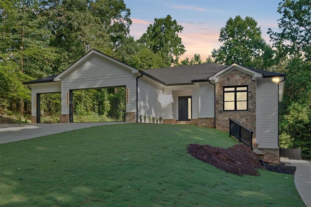 Modern Newly Renovated Ranch in Woodstock, GA.
Welcome to this stunning, newly remodeled modern ranch, a rare find nestled on a serene 1.5-acre cul-de-sac lot in the heart of Woodstock, Georgia! Boasting 6 bedrooms, 4.5 bathrooms, and an expansive 5,278 square feet of thoughtfully designed living space, this home offers an unmatched blend of luxury, privacy, and convenience.
Highlights:
- Open Ranch Layout: The spacious floor plan features a huge kitchen with modern finishes, a large island, and breathtaking views of the oversized living room, making it perfect for entertaining.
-Sunroom Retreat: Enjoy your morning coffee or evening unwind in the bright and airy sunroom, seamlessly connected to the main living areas.
-In-Law Suite: A fully finished basement with a private entrance offers a complete in-law suite setup, perfect for multi-generational living or rental potential.
-Garage Space Galore: A three-car garage provides ample room for vehicles, tools, and storage.
-Prime Location: Situated in a quiet neighborhood with no HOA and with low Cherokee Co.taxes yet just minutes from I-575, Downtown Woodstock, Sixes Road, Costco, Publix, and the Outlet Mall.
This property combines the best of modern living with the tranquility of a private, wooded lot. Whether you're hosting family gatherings, enjoying the peace of your expansive outdoor space, or exploring the vibrant local area, this home delivers.
Motivated Seller will consider all reasonable offers! Don’t miss this incredible opportunity to own a piece of paradise in Woodstock! Schedule your private showing today and start imagining your future here.