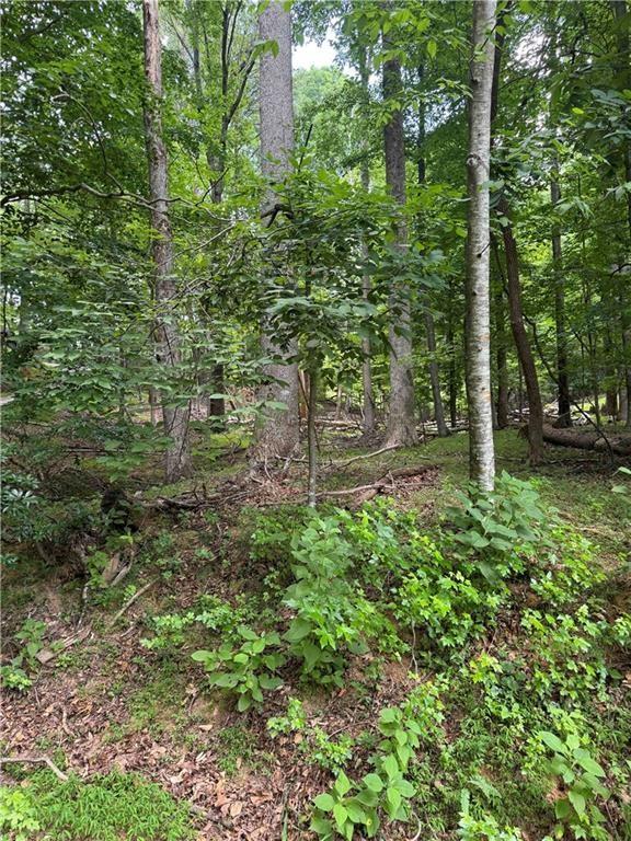 Welcome to your dream home site in the prestigious Bent Tree Community! This expansive double lot offers an opportunity to build your custom home amidst serene surroundings and located near the front gate! Nestled within over 3,500 acres of resort-style living, this lot boasts stunning wooded views and direct access to the meticulously maintained golf course. Imagine stepping out your door and enjoying a leisurely walk on the greens whenever you desire.Bent Tree is more than just a neighborhood; it's a lifestyle. Indulge in the numerous amenities this community has to offer. 18-Hole Golf Course: Perfect your swing on the championship course that winds through the picturesque mountainside.You will enjoy fishing in the well-stocked Lake Tamarack or embarking on a peaceful kayaking adventure. Horse enthusiasts will appreciate the on-site stables, pastures, and riding arena. It is easy to stay active with pickleball, tennis, and swimming facilities just around the corner. Enjoy delicious meals and social gatherings at The 19th Hole restaurant. Don't miss this exceptional chance to build your dream home in a community that combines natural beauty, recreational activities, and modern conveniences. Come take a look at this prime double lot and envision the endless possibilities for your new construction home!