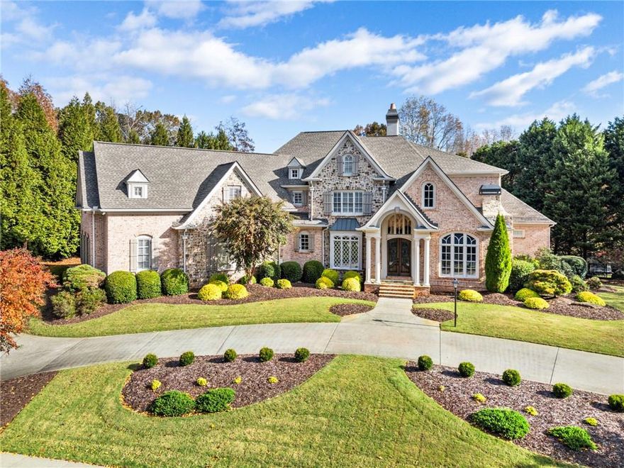 Stunning elegance overlooking the 14th green in gated White Columns. This newly renovated European home is well-appointed with all the designer finishes. The reimagined kitchen is every chef's dream, featuring a new 48" Wolf range, 48" Subzero refrigerator, beverage center + wine cooler. The new custom cabinets are complemented by Cambria quartz countertops and backsplash. Don't miss the updated pantry with new cabinetry + lighting. The details are intentional as they are beautiful: all new hardware, custom accent walls, designer lighting, smart dimmers + switches, and some electric blinds. Four bedrooms on the upper level each offer charm, character and generous space. Every bathroom has been touched with custom vanities, quartz countertops, and new toilets. The terrace level features a bar and media area along with a cozy gathering space with a fireplace. The gym is spacious enough for cardio equipment and yoga. The lower-level bedroom overlooks the pool terrace and lush landscaping. Not only is this home beautiful, but the systems are newer and updated from the AC to the hot water heaters. The outdoor living space is designed for the entertainer! The pool is surrounded by mature landscape + uplighting, an open deck overlooking the pool and a trellis seating area. White Column residents can enjoy the community pool, swim team and tennis court, and course golf memberships are available. Come explore the resort lifestyle and community of White Columns. Located near award-winning public + private schools, boutique shops and restaurants. Welcome Home.