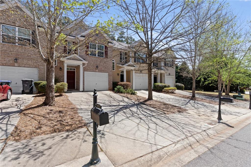 Welcome Home! This 2 bedroom / 2.5 bathroom home townhouse is nestled in the highly sought after Pinnacle Glen subdivision. Step inside to the foyer and be greeted by stairs to your left and the living room with fireplace ahead. The beautifully designed eat-in kitchen features stained cabinets, laminated counters, pantry, and views of the cozy family room! The master bedroom offers plenty of space and a walk-in closet! The en-suite bathroom has dual vanities, a separate shower, and a soaking bathtub. Additional bedroom with a separate full bath is perfect for overnight guests. Tons of natural light throughout the home. Step outside to the fenced in spacious backyard for fun with the family and friends. Conveniently located close to 400 and Cumming. Come see all this gorgeous townhome has to offer, you won’t be disappointed!