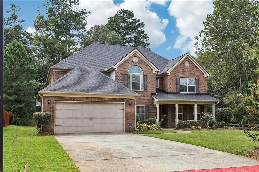 Beautifully updated 5BR/4.5BA home in Ellenwood! Fresh LVP flooring and paint throughout, newer roof and water heater. Main level features a large dining room, flex/office space, fireside living room, and kitchen with stained cabinets, island, walk-in pantry & new appliances. Full bedroom and bathroom suite on main. Upstairs find a spacious primary suite with sitting room and an ensuite bathroom with double vanity, soaking tub & separate shower, plus 3 secondary bedrooms (one with ensuite bath). Enjoy the flat backyard with covered patio—perfect for entertaining!