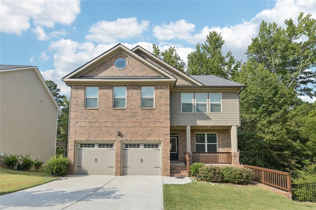 This 2019 dream home blends modern design with everyday comfort in a layout that truly works. With 4 bedrooms, 3 full baths, and thoughtful details throughout, it offers a warm, inviting feel the moment you walk in. Natural light fills the open-concept kitchen, complemented by laminated floors throughout and clean, modern accent walls. The spacious family room centers around a cozy fireplace—perfect for both relaxing nights and casual gatherings. Step outside to a two-level deck designed for entertaining, or enjoy quiet mornings on the charming front porch. The full, unfinished basement provides endless potential: home office, gym, studio—you decide. Tucked in a peaceful community just minutes from the interstate, this home offers a balance of privacy and convenience, plus $3,000 toward closing costs with a preferred lender. Contact your agent today to schedule a showing.