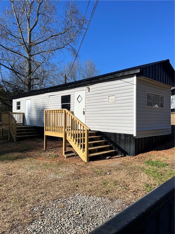 One bedroom one bath mobile manufactured home in center of Jasper, GA. Partial remodel in 2025 including new metal roof, new flooring, new lighting, new decks, and other repairs. Just large enough for one or two people. Owner maintains the lawn care. Locking mailboxes on site. Tenant must pass background check and have sufficient income. (This is one of three units remodeled on the same property that will be listed simultaneously: 336 and 338 are practically identical, and 340 is larger with 2 bedrooms - see all three FMLS listings for details).