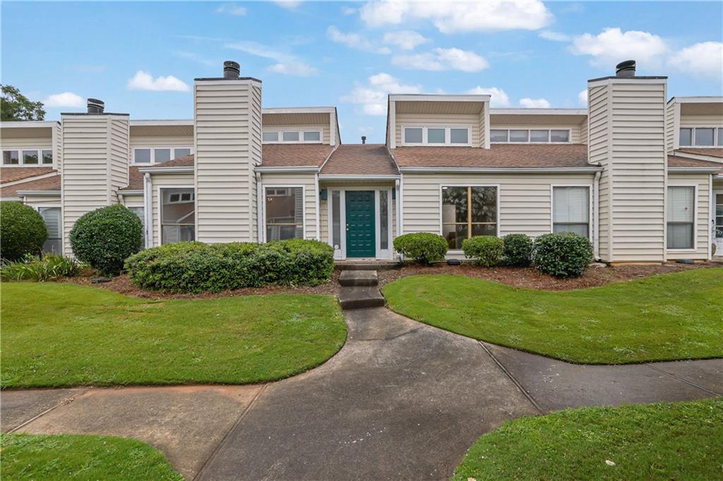 Stunning, Fully Renovated Single-Level Condo in Prime Marietta Location! This move-in-ready gem has been meticulously renovated from top to bottom with high-end finishes. The kitchen features brand new shaker style cabinetry with soft-close drawers & cabinets, sleek quartz countertops, and a marble tile backsplash. Enjoy soaring ceilings and abundant natural light in the spacious main living area. The master bedroom boasts a luxurious ensuite bathroom with a fully tiled walk-in shower, modern vanity, and new fixtures. Two additional bedrooms offer direct access to a private patio through NEW sliding glass doors. Additional updates include NEW LVP flooring throughout, FRESHLY painted interior, NEW interior doors & hardware, NEW light fixtures, NEW plumbing fixtures, NEW appliances. Additional highlights include an attached 2-car carport, newer HVAC and water heater. Located in a beautifully maintained community with two pools, tennis courts, and pickleball. HOA includes water, sewer, trash, and pest control. Welcome Home! Owner/Agent.