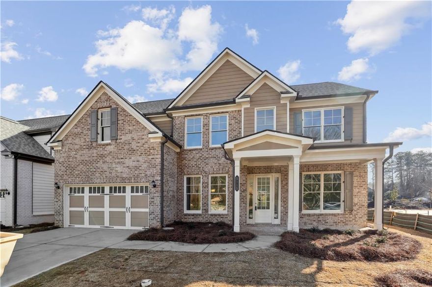 In Creekside Landing, a new home development of 41 homesites, this new WILLIAMSBURG floorplan is the dream home for which you have been waiting. Located in top rated North Gwinnett High School and North Gwinnett Middle School, a rare new construction opportunity for these great schools! Lot premium waived! 
This home, set beautifully on a lovely cul de sac lot, welcomes with a sunlit two-story entry foyer flanked by a living room/home office space and an elegant formal dining room. 10 foot ceilings on the Main Level. The foyer leads to a soaring two-story family room with open views to a bright, fabulous kitchen and breakfast. The kitchen has a large center island, white cabinets, quartz countertops, stainless steel appliances with a gas range and microwave. The breakfast area leads to a patio that is very private. Set in the heart of the cul de sac, the yard extends to wrap much of the cul de sac. This outstanding family plan provides five bedrooms, including a guest suite on the Main Level with a full bath with tile flooring, quartz countertop, cast iron/porcelain coated tub with full tile surround.  Upstairs enjoys an added Media Room. There are three more spacious secondary bedrooms upstairs that share a hall bath. The large primary suite provides a luxurious bathroom retreat featuring a garden tub, separate frameless shower and a spacious closet. All bath floors are tile with tile surround bathtubs and/or showers. All baths come with quartz countertops.  The seller provides an electric car charge outlet in the garage. Construction is in progress...still time to make selections.  ESTIMATED READY-TO-CLOSE LATE NOVEMBER-MID DECEMBER.