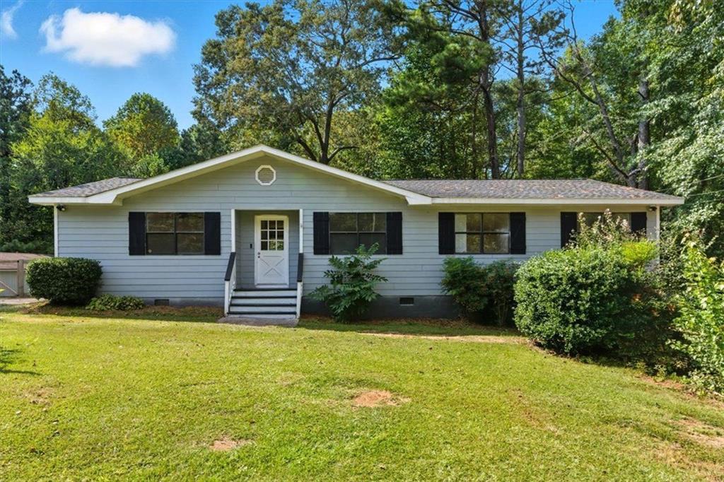 This one level ranch home sits on almost an acre and has a detached workshop with an office! With three bedrooms and two full bathrooms this home has been updated and is move-in ready. Updates over the last couple of years include fresh paint inside and out, new hvac, new roof, new side porch, new bamboo and tile flooring, and more. The peaceful back deck overlooking a wooded lot features an outdoor fireplace that is the perfect spot to enjoy the upcoming fall weather. The detached garage has a climate controlled office and offers a huge space for a workshop or boat/toy storage. This home is a great value so schedule your showing and come see all it has to offer!