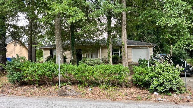 Ranch style home with spacious great room! Includes large kitchen, cozy bedrooms, and a deck that overlooks the backyard. This charming single-family home is nestled in a vibrant and welcoming neighborhood, offering the perfect blend of city convenience and suburban charm. Easy access to nearby Wilson Mill Park, convenient to shops, restaurants, the airport, and major highways for convenient commuting. Experience the perfect blend of style, comfort, and location! Schedule a viewing today and make this gem your own!