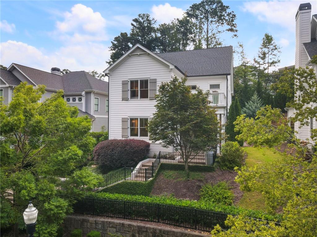 Welcome to your new lifestyle in the heart of Chamblee! Perfectly located between Keswick Park, neighborhood restaurants, and scenic trails, this stunning home blends elegance, comfort, and thoughtful upgrades. The main level features oak hardwood floors, a family room with a gas fireplace, a dining area that flows into the gourmet kitchen, a walk-in pantry, a dedicated office with custom built-ins and French glass doors, and a spacious guest suite with an ensuite bath and walk-in closet.
Outdoor living is just as impressive, with a covered porch complete with a swing bed, a heated rear porch for year-round comfort, and a private fenced courtyard featuring artificial turf, a custom platform for grilling or seating, and a massive gas firepit. A large driveway and oversized garage with extra storage make everyday living effortless.
Upstairs, the large primary suite includes dual walk-in closets, a morning kitchen, and a spa-like bath with herringbone marble floors. A 400 sq ft conditioned flex space off the primary suite offers the perfect spot for a gym, studio, or additional storage. Two secondary bedrooms, each with ensuite baths and walk-in closets, complete the upper level, along with a laundry room outfitted with built-in cabinets, a sink, and an ironing board. The upstairs deck provides the perfect place for sunbathing or lounging.
Additional upgrades such as a whole-home water filtration system, a whole-home generator, Hunter Douglas custom blinds throughout (most are motorized), LED lighting throughout, instant gas water heater, 4k security cameras with 2TB storage, Level 2 EV charging station, epoxy finished garage floors and more!