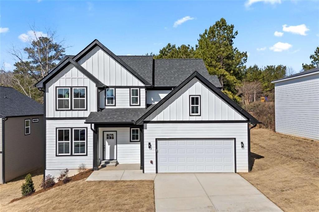 Welcome to this stunning NEW CONSTRUCTION 3-bedroom, 2.5 bath home, thoughtfully designed for both style and functionality. Experience true hardwood floors flowing throughout the home, complemented by stylish tile in the bathrooms and laundry room. The main floor greets you with a welcoming foyer, leading to a separate dining room and a beautifully appointed kitchen featuring ample white cabinetry, a large solid surface island, and countertops. The kitchen seamlessly flows into the living room, creating the perfect space for entertaining. An additional main-floor flex space offers endless possibilities - it can serve as extra storage, a mudroom, or a cozy office. The garage has been upgraded with an epoxy-coated floor for added durability and style. Abundant windows throughout the home allow natural light to pour in, creating a bright and airy atmosphere. Upstairs, you'll find three generously sized bedrooms, including a luxurious primary suite with a spacious en-suite bathroom featuring a double vanity, tile floors, a separate tub and shower, and a large walk-in closet. The two additional bedrooms each include walk-in closets and share a charming Jack-and-Jill bathroom, accessible through stylish sliding barn doors. This bathroom is complete with a double vanity, tile floors, and a tub/shower combo. A conveniently located, well-sized laundry room with tile flooring completes the upper level. For even more potential, this home sits on an unfinished basement, ready for your personal design touches. Don't miss the opportunity to make this exceptional home yours! Priced below appraised value and is available now!