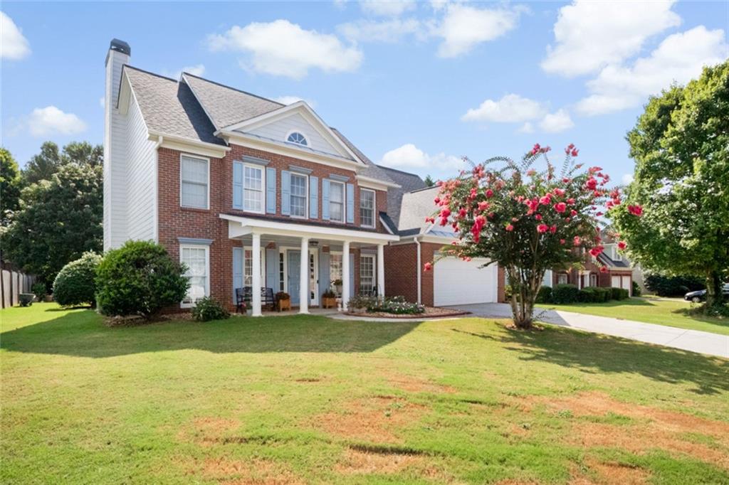 Welcome to this beautifully maintained 5-bedroom, 3-bathroom brick-front home that blends classic charm and modern comfort. In quiet Hunters Glen, well-kept neighborhood. As you enter, you're greeted by a bright and welcoming foyer with wood flooring that flows seamlessly throughout the main level. French doors open into a versatile front room—ideal as a home office or playroom. Step into the formal dining room, perfect for gatherings or holiday meals. It’s a warm and welcoming space you’ll love hosting in. The main level features a bright and open floor plan with a cozy living room centered around a fireplace. The kitchen is equipped with sleek stainless steel appliances, white cabinetry, and a wrap-around breakfast bar—perfect for morning coffee. The adjoining breakfast area is surrounded by windows, offering ample natural light. One of the standout features of this home is the private downstairs bedroom with a full bathroom—perfect for guests, in-laws, or anyone who prefers no stairs. Upstairs, you’ll find spacious bedrooms. The soft pink room is a sweet setup for a kid’s room or nursery. The primary suite is a relaxing retreat with a tray ceiling, walk-in closet, and a full en-suite bath. Enjoy a soak in the large tub, a quick rinse in the stand-up shower, and get ready for the day at the dual vanity with plenty of counter space. The roof was replaced in 2021, the furnace was replaced in 2022 & the water heater was replaced 2020. You'll enjoy the location with easy access to shopping, restaurants.