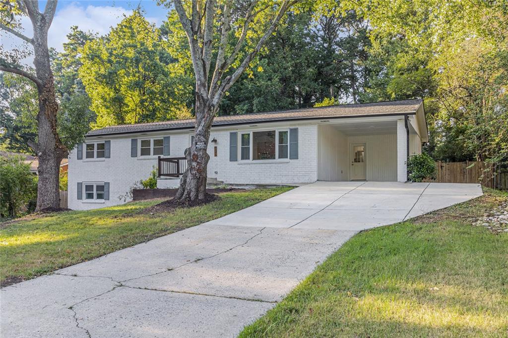 Fully renovated brick ranch on finished basement. This spacious home nestled in the heart of Norcross features 4BD/2BA, 2 additional bonus rooms and 2 family rooms in the basement. The basement has a separate entry, driveway and sidewalk, perfect for large and multi-generational families. On the main level you are greeted with brand new gorgeous LVP flooring, a modern electric fireplace and a spacious white kitchen with brand new appliances and stone countertops. Enjoy the privacy of a large fully fenced backyard and deck. This property is just minutes away from the access to I-85, Peachtree parkway shopping, and dining establishments. With the absence of HOA restrictions, you'll enjoy the freedom to personalize this residence to your liking. Don't miss this rare opportunity to own a versatile home in a prime location, it won't last long!