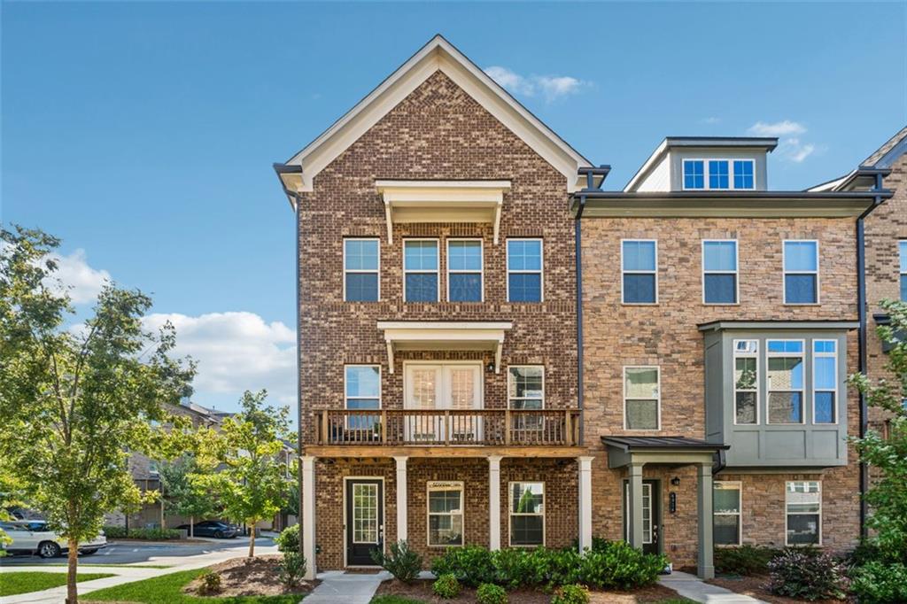 New on Market! OPEN 2-4 Sunday 9/14 A rare opportunity to own a stunning end unit townhome in the coveted 5200 at Town Center community, ideally located in the heart of Peachtree Corners and directly across from The Forum. Ranked #1 in Georgia on Fortune’s 50 Best Places to Live for Families, this residence offers an unmatched lifestyle of convenience, walkability, and luxury. Step outside your door and find yourself immersed in a vibrant town center with access to the town green, playground, dog park, movie theater, boutique shops, and top-tier restaurants—all just moments away. The pedestrian bridge to The Forum adds even more shopping and dining options to your daily routine. Zoned for the highly acclaimed Simpson Elementary School, this home is perfect for families seeking both quality education and a dynamic community.
Inside, Lennar’s Bayfield floorplan showcases 10-foot ceilings and wide 7-inch plank LVP flooring throughout, creating a spacious and modern ambiance. The living room features custom built-ins and opens to a large deck—ideal for entertaining nearly year-round. The chef’s kitchen is a showstopper, with a massive granite island, white shaker-style cabinetry, built-in oven and convection mic, gas range, stainless steel appliances, and a walk-in pantry. Overlooking the kitchen is a generous dining area complete with, butler’s pantry, and elegant chandelier. A convenient half bath rounds out the main level.
Upstairs, the owner’s suite offers a peaceful retreat with a spa-inspired bathroom and walk-in closet, while two additional bedrooms share a full bath. The lower level adds versatility with an entry foyer, a fourth bedroom that can double as a home office, a full bathroom, and a drive-under garage Still covered under Lennar’s structural warranty for six more years, this townhome combines peace of mind with upscale living. With its unbeatable location and thoughtful design, this home won’t last long—schedule your showing today!