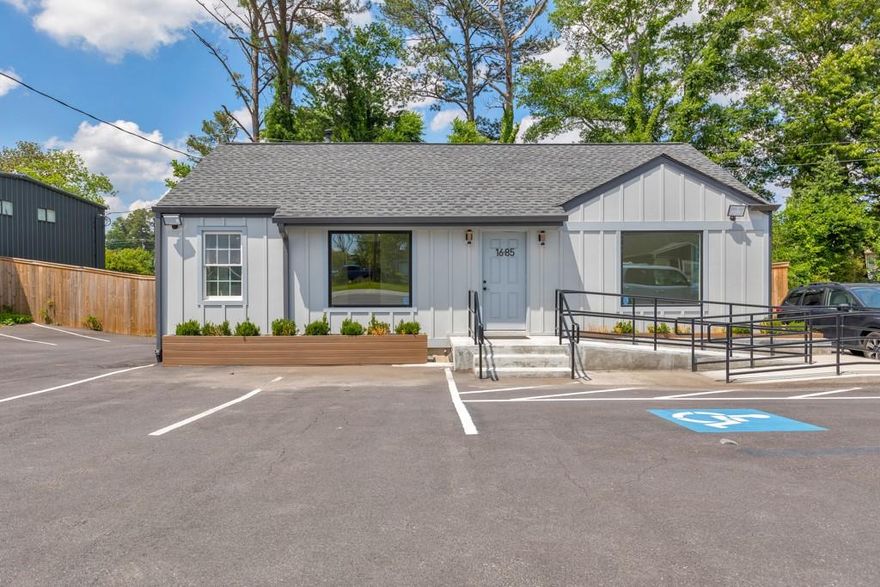 Unlock the potential of your business with this beautifully remodeled mixed-use space offering nearly 2,000 sq ft of functional and flexible layout. Situated on a high-visibility road, this property features excellent frontage and current parking for 6 vehicles—with plans underway to add 10 more spaces behind the building. Step inside to a spacious reception area that welcomes clients and guests, leading to four private offices on the main level. A shared kitchen with a sink, refrigerator, and microwave provides added convenience, along with one full bathroom and a half bath for staff and visitor use. Water access is available in every room, making this space ideal for a variety of business types. The lower level includes a large multi-purpose room perfect for a conference space, training area, or a fifth private office, along with an additional full bathroom. Two fenced areas behind the building offer added flexibility for storage, equipment, or secure outdoor use. This move-in ready space is ideal for professional offices, medical or wellness services, or creative studios. Don’t miss this opportunity to elevate your business in a prime location!