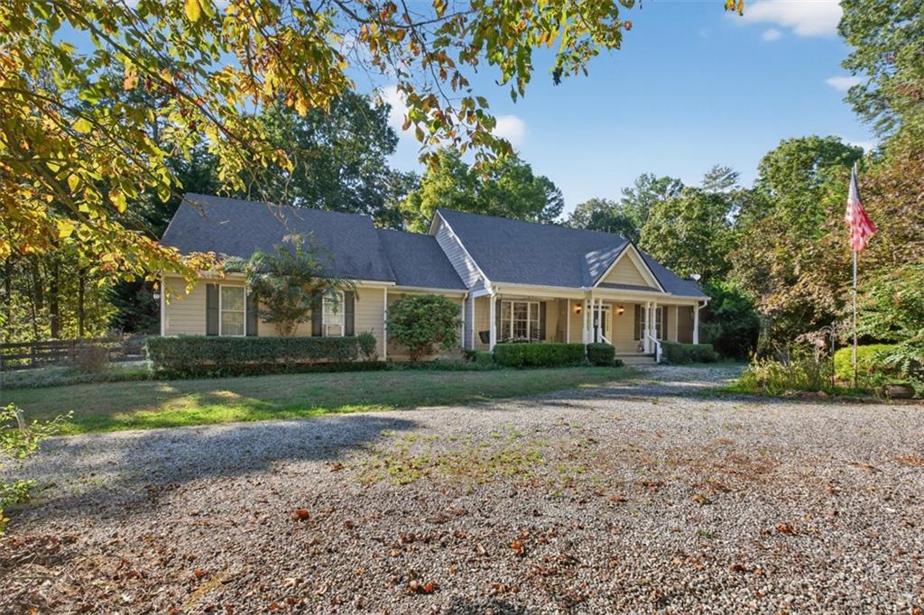 If PRIVACY, space for your HORSES to roam, and a beautiful RANCH on a FINISHED basement with an ELEVATOR are on your wish list... this property delivers it all! Nestled on just under 7 ACRES of peaceful countryside, this GATED retreat is perfect for animal lovers and those seeking a serene lifestyle. The property includes a BARN with two STABLES and a fenced PASTURE, offering the ideal setup for horses, farming and exploring. Inside, you’ll find an inviting, open floor plan with gleaming HARDWOOD flooring throughout the main living areas. The spacious great room features a stunning stack-stone fireplace, perfect for the whole family to gather around on those cozy nights and the high ceilings allow for that 20-foot Christmas tree! The chef’s kitchen sits at the heart of the home and boasts granite countertops, a tile backsplash, stainless steel appliances (including a warming drawer), and a LARGE ISLAND with seating. Adjacent to the kitchen is the formal dining room that can easily sit 12 or more. So much character throughout with crown moulding, chandeliers, a wet bar and picture windows that bring in so much NATURAL LIGHT. Step outside to enjoy the expansive deck or SCREENED-IN covered porch, both perfect for outdoor entertaining or relaxing under the stars. There’s even a natural gas line ready for your grill. The oversized primary suite on the main level is a true retreat, offering HIS AND HERS SEPARATE BATHROOMS! I mean, WOW!! Take the elevator down to the finished basement which provides incredible versatility with two additional bedrooms, two full bathrooms, a SECOND KITCHEN (that can easily be expanded), and a flex room that could serve as a family room, office, or gym. You’ll also find a cozy fireplace, ample storage and exterior access to the backyard. Notable updates include two new hot water heaters and the roof was replaced in 2019. With space, function, and privacy, this property offers the perfect blend of country living with modern convenience—close to shops, restaurants, and major highways for commuting convenience. Minutes to Crystal Falls golf course. This gated and private property is truly one of a kind—ready to welcome you home!