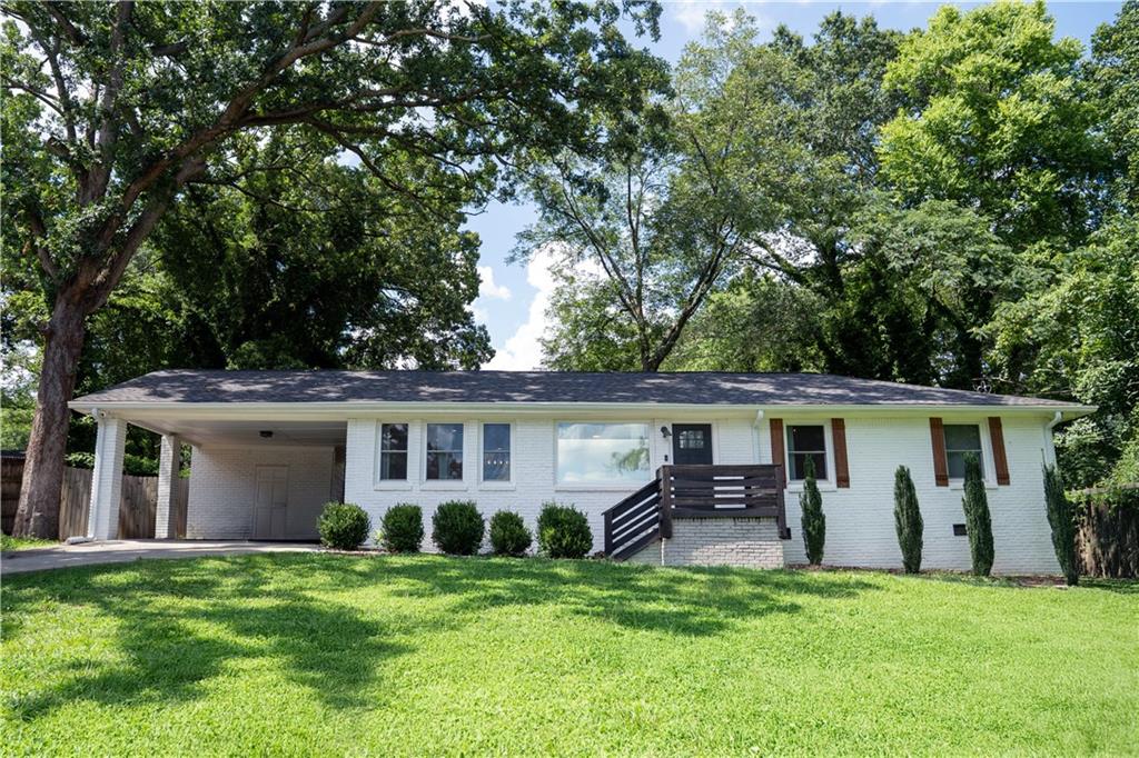 Fully Renovated. Stylishly Designed. Perfectly Located.
Welcome to 2287 Hill Street NW, a completely reimagined three-bedroom, two-bathroom home in Atlanta’s booming Center Hill neighborhood. Set on a spacious lot with a rare two-car carport, this property blends modern upgrades with classic charm for a true move-in ready experience.
Step inside to an open, sun-filled layout featuring beautifully refinished hardwood floors, upgraded double pane windows, and an oversized sunroom perfect for entertaining. The chef’s kitchen features crisp white cabinetry, granite countertops, and brand-new stainless steel appliances, designed for both everyday living and elevated hosting.
The primary suite offers a private retreat, complete with a spa-inspired bath and a large walk-in shower. Both bathrooms have been fully renovated with high-end finishes throughout. Outside, enjoy a large fenced backyard ideal for relaxing, gardening, or gathering with guests.
Located just minutes from Westside Park, the BeltLine, and the best of West Midtown dining and shopping, this home delivers the rare combination of space, style, and convenience.