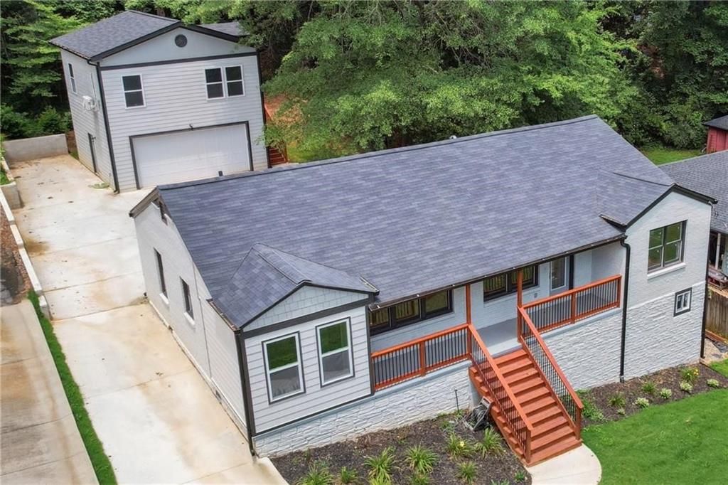 Revenue producing zoned detached ADU unit as a bonus to this fully renovated Druid Hills Emory District home. Enjoy the live-walk downtown Decatur stores, shops and restaurants as well as the conveniences of the Emory square, Fernbank Museum, Druid Hills country Club, Piedmont Park and more. This spacious residence features an open-concept floor plan with family room and kitchen with a massive island, sleek stainless steel appliances, and a stylish backsplash. Main house offers four bedrooms and three full bathrooms, including a spacious primary suite with an ensuite featuring a glass shower room. A dedicated office provides the perfect space to work from home. Detached ADU (Accessory Dwelling Unit) complete with its own in-wall A/C units, full kitchenette, living and dining areas, bedroom, and a custom-designed bathroom—ideal for guests, or rental income. Schedule your showing today! Calculated Lower level square footage in FMLS is designating ADU unit heated and cooled square footage.