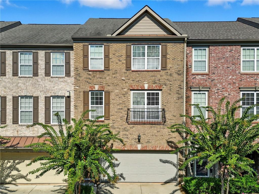 Beautifully maintained townhouse with an open-concept floor plan, hardwood floors, cozy fireplace, and a chef's kitchen featuring granite countertops, stainless steel appliances, and a gas stove. Step onto the private deck for outdoor entertaining. Upstairs, the owner's suite boasts a tray ceiling, spa-like bath with soaking tub, separate shower, dual vanity, and walk-in closet. The guest suite has vaulted ceilings, its own full bath, and a large walk-in closet. The terrace level offers a third bedroom/bonus room with full bath, plus garage and exterior entry-perfect for media, office, or guest use. Updates include hardwoods, new carpet, new LVP flooring, fresh paint. Two-car garage and excellent location near Peachtree Parkway, Peachtree Industrial Blvd, The Forum Shops, and dining. Move-in ready and in great condition-don't miss this one! The leasing cap is set at 30 units and has not yet been reached. For your investment, please note that the buyer is responsible for contacting and confirming the exact number of units still available.