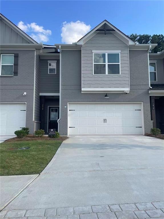 Tucked inside the upscale, gated enclave of Rockfern Place in Norcross, GA, these homes put everyday convenience within easy reach—just 2 miles from I-85. Enjoy quick access to Downtown Norcross, Old Town Lilburn, shopping, dining, parks, and year-round city events. Designed for low maintenance and energy efficiency, every home carries the Right Choice™ designation and pairs striking curb appeal—painted brick with warm cedar accents—with fresh, modern interiors: EV-ready charging outlets, airy upstairs lofts, kitchens with quartz countertops, stainless appliances and white shaker cabinetry, plus enlarged showers in the primary bath and more.