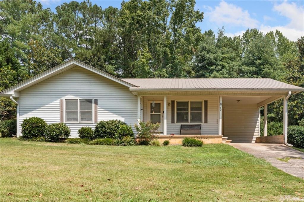 Charming 3-Bedroom Ranch Home on a Private 1-Acre Lot!
Welcome home to this 3-bedroom ranch-style home nestled on a peaceful 1-acre lot. Tucked away in a quiet, wooded setting, this home offers privacy while still being just minutes from local restaurants, shopping, and everyday conveniences.
Step inside to find a spacious and functional kitchen with ample cabinet space and a cozy dining area. The home features three comfortable bedrooms, ideal for family living, guests, or a home office. Enjoy relaxing on the covered front porch or entertain in your expansive backyard surrounded by mature trees—perfect for gardening, pets, or simply enjoying the outdoors.
Additional highlights include a covered carport, large storage closets, and low-maintenance vinyl siding and metal roof. A concrete driveway and large storage building add convenience and value. This price point is a rare find for the area. Whether you're a first-time buyer, downsizing, or seeking a quiet retreat close to town, this property offers the best of both worlds.
Don’t miss this opportunity to own a slice of tranquility with modern convenience nearby!