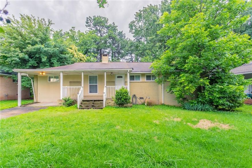 Nestled in the established Dunhill Acres neighborhood, this classic brick ranch offers comfortable one-level living with timeless appeal. The home features three bedrooms and two bathrooms, including a primary suite with its own bath. A spacious living room with a decorative fireplace opens into a dining area and eat-in kitchen, creating an inviting flow for everyday living. A bonus room adds flexibility for use as a home office, playroom, or den. Outside, enjoy a quiet, level lot with both a front porch and rear patio—ideal for relaxing or entertaining. Conveniently located in Decatur with easy access to local shops, major highways, and MARTA.