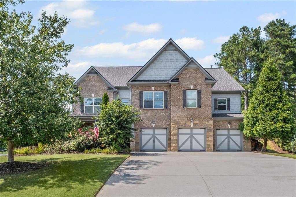Sought-After Alpharetta Address with Forsyth County Schools & Taxes!
Welcome to this beautifully updated and impeccably maintained 6-bedroom, 5-bathroom home in Castille, an exclusive gated community of just 37 executive homes. Situated in a prime Alpharetta location with the benefit of top-rated Forsyth County schools and lower taxes, this home blends luxury, comfort, and convenience. The main level boasts an inviting open floor plan designed for both everyday living and entertaining. Step through the covered rocking chair front porch into a grand two-story foyer. Highlights include an executive home office, a formal dining room with coffered ceilings, a fireside family room, breakfast area, and a cozy fireside keeping room. The gourmet kitchen is a chef’s dream, featuring double ovens, stone countertops, stainless steel appliances, custom tile backsplash, two large islands, and ample workspace. A bedroom with a full bath and a mudroom completes the main floor. Upstairs, you'll find a charming reading nook with a custom window seat and built-in bookshelves, a large laundry room with cabinets and sink, four generously sized bedrooms and three full baths. The luxurious primary suite offers a private sitting area, two walk-in closets (including a custom-designed one), and a spa-like bath with a soaking tub, oversized tiled shower, and double vanity. The finished third level includes a full bath, flexible living space, a 6th bedroom, and the option for a 7th—perfect for a guest suite, media room, or home gym. Outdoor living is just as impressive, with covered front and back porches, an expanded patio, a fire pit, and a large, level fenced backyard—ideal for play or relaxation. Enjoy close proximity to Polo Fields, Vickery Village, Downtown Alpharetta, and GA 400—all while coming home to peaceful, private surroundings. With a brand-new roof and true move-in readiness, this home is the total package.