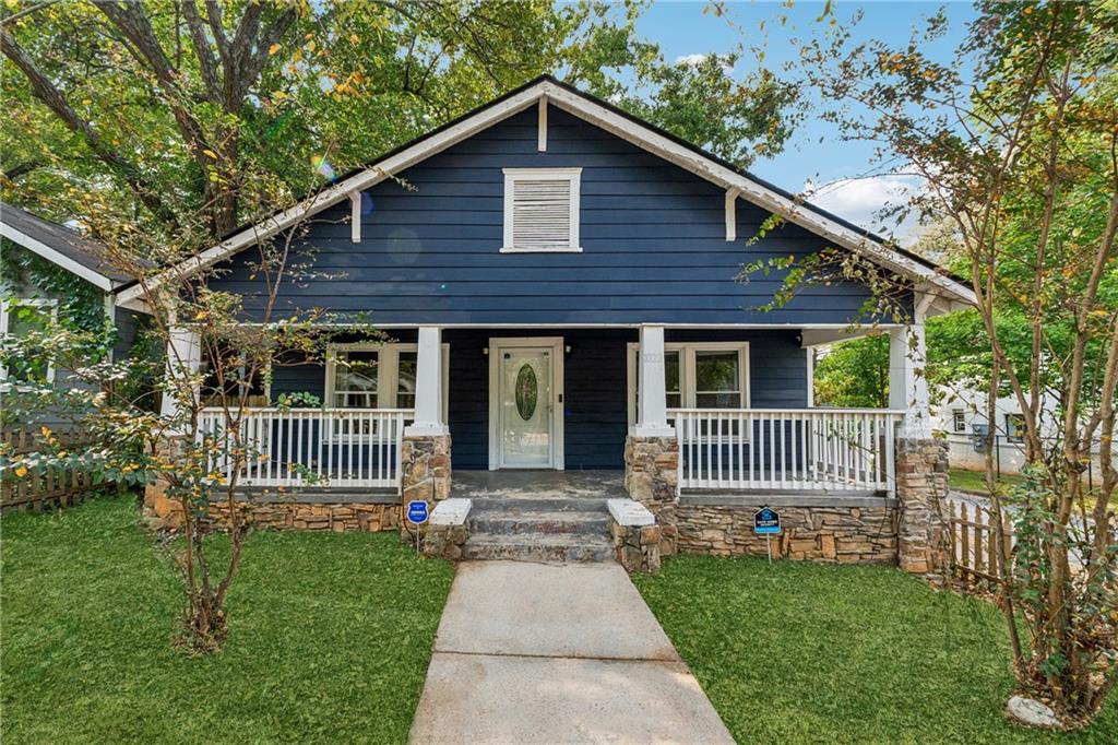 Don’t miss this rare 3-bedroom, 3 full-bathroom home in the historic West End/Ashview Heights neighborhood, offering a floor plan that is perfectly suited for roommates, students, or single-family living. Each bedroom features its own adjacent full bathroom, a highly sought-after design that makes the property ideal for student housing, co-living arrangements, or a roommate plan, while also providing the privacy and convenience that families value. The en suite primary bedroom includes a spacious closet and decorative fireplace, adding both comfort and charm. At the heart of the home, the expansive kitchen combines style and functionality with stainless steel appliances, solid countertops, abundant cabinetry, and generous space that makes it perfect for entertaining. With Morehouse, Spelman, and Clark Atlanta University nearby, along with quick access to the Westside BeltLine, Mercedes-Benz Stadium, and downtown Atlanta, the location offers unmatched convenience and long-term appeal.
The large covered front porch creates a welcoming entryway, while the fenced backyard provides ample space for gatherings, gardening, or quiet relaxation. Situated on a corner lot, the property offers additional privacy, curb appeal, and off-street parking. Nearby schools such as M.A. Jones Elementary and Booker T. Washington High, while investors will recognize the strong rental demand supported by the home’s roommate-friendly layout. Whether you are seeking a high-demand rental property or a turnkey residence with modern updates and classic Atlanta charm, this home delivers exceptional versatility in one of the city’s most connected and fastest-growing communities.