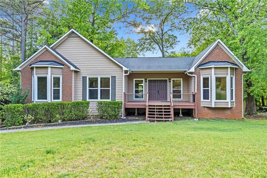 Spacious 4BD/3BA Gem in Top-Rated Lassiter School District - With Finished Basement & Dreamy Outdoor Living!    This is a must-see! Located in the highly sought-after Lassiter school district, this beautifully maintained East Cobb home offers 4 bedrooms, 3 baths, and a full finished basement-perfect for entertaining, relaxing, or extra living space.    Inside, you'll find a beautifully maintained home featuring a separate dining area, a chef-inspired kitchen with solid wood cabinets, granite countertops, space for dining and all appliances included!    The inviting family room features vaulted ceilings and a brick fireplace, with direct access to a newly built porch off  the living room    Though this home has two levels, three of the 4 bedrooms in the home are on the main level, giving the home a ranch-style feel. In addition to two bedrooms and full bathroom on the main level, there is also a large Primary suite, equipped with a spa-like bath with a custom tiled shower and soaking tub    Need storage? You've got it!-tons of space in the 2-car garage plus a huge basement that includes a storage room and an additional bedroom and bathroom, ideal as an in-law suite, gym area or an office.    Outside, the large backyard offers garden beds, a shed, fire pit and plenty of space to play or unwind.     Located just minutes from I-75, I-575, KSU, Kennestone Hospital, shopping & dining, with an optional pool membership in a voluntary HOA community.     Homes in this location don't last-schedule your private tour today!