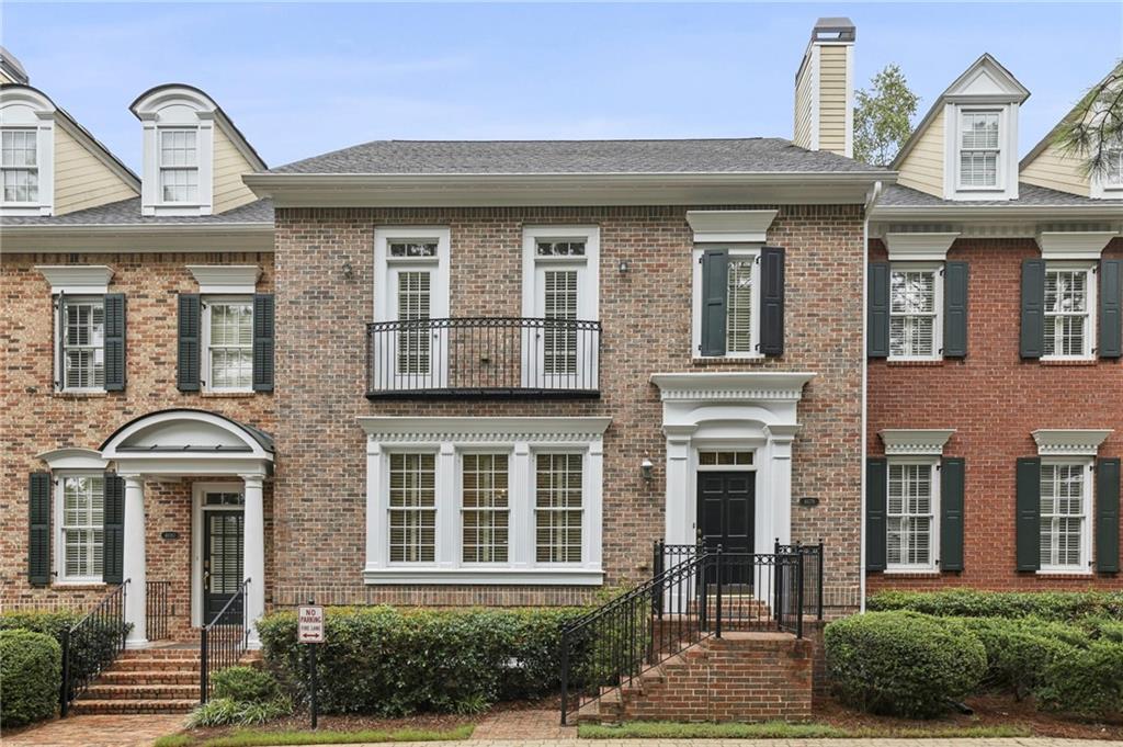 This sophisticated townhome is perfect for the buyer looking for a "transitional yet traditional" look and feel for their next home - comfortable yet elegant, open plan yet separate spaces, friendly community yet private lifestyle. Enter the foyer to the sweeping staircase and an elegant dining room with built-in cabinets and pocket French doors. The main floor features a spacious living room with fireplace, hardwood floors, bright sunroom, and a wonderful cook's kitchen with center island, Subzero refrigerator, Bosch oven/microwave, pantry and breakfast area. The second and third levels feature a primary bedroom with large bath and closet, and en-suite secondary bedrooms on the second and third levels. The terrace level is finished with a full bath, loads of closets, and a bedroom or cozy den. The gated community features a scenic walking trail, clubhouse, fitness center, and pool. Enjoy low Cobb taxes yet live just minutes to major highways, downtown Vinings, and the best of Atlanta.