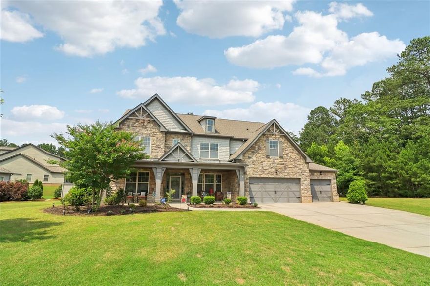 SELLER PAID 1% INTEREST RATE BUY-DOWN! You must see this beautiful 2017 executive home in the exclusive west Cobb community on a cul-de-sac with a resort-style saltwater pool! Sellers have completed $30,000 in upgrades and improvements - all you have to do is move in and enjoy luxurious resort-style living in top rated Harrison District. This spacious 3,910 sq ft 5 bed / 4 full bath home is perfect for a large or growing family. Sitting on expansive .466 acres and the best premium lot in the neighborhood, it boasts a 3-car garage and level fenced backyard. Pristine hardwood flooring throughout ENTIRE home. On the main level you’ll find a grand 2-story foyer, a formal dining room with coffered ceiling, large main level office with French doors, and a convenient guest/in-law bedroom suite. You will love the open concept family room with extra-large and plentiful windows providing tons of natural light! The exquisite chef’s kitchen features granite countertops, soft close cabinets (also throughout home), double oven, subway tiled backsplash, oversized Island, gas cooktop, and upgraded appliances. Upstairs features 4 additional spacious bedrooms including an oversized primary suite with trey ceiling, his & hers granite sink, tiled shower, garden tub and huge walk-in closet. Also, upstairs - a huge loft bonus room, currently a Pilates studio! Also upstairs are two full bathrooms and a laundry room. The backyard is an entertainer’s dream featuring a saltwater swimming pool with waterfall, game day covered living space with fireplace & TV. This safe west Cobb neighborhood is close to downtown Acworth and Lake Allatoona, as well as schools, shopping, and upscale west Cobb dining. It’s hard to find a 5-bedroom custom home that was built in 2017 or newer in the Harrison district. Sellers are providing an active termite bond and home warranty. The empty lot next door is owned and beautifully maintained by the neighbor next door, so no one will build on that lot. Come see this gorgeous pool home now before it’s gone!