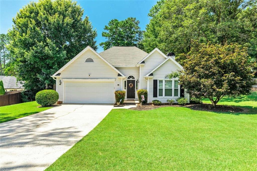 Charming Move-In Ready Ranch in North Peachtree City! Welcome home to this beautifully maintained 3-bedroom, 2-bath ranch, ideally situated in one of Peachtree City's most sought-after neighborhoods with easy access to Hwy 74 and I-85. Located just a short walk or golf cart ride to Kedron Shopping Center, parks, and top-tier recreational facilities - to include Kdron Aquatics Center, this home offers convenience and lifestyle in one perfect package! Step inside to find gleaming hardwood floors and a popular open, split-bedroom floor plan with vaulted ceilings that create a bright and airy living space. French doors open into a light-filled sunroom-perfect for morning coffee or a quiet reading nook. The spacious kitchen features granite countertops, stainless steel appliances, tile backsplash, a food pantry, and a breakfast area surrounded by triple windows for plenty of natural light. The oversized back deck is ideal for entertaining, and the large, fenced backyard provides space for pets, gardening, or outdoor play. Retreat to the primary suite with trey ceiling, walk-in closet, and an en-suite bath complete with double vanities, a garden tub, and separate shower. Bedroom #2 boasts vaulted ceilings and a beautiful palladium window, making it perfect as a guest room, office, or additional living space. Additional features include a large 2-level floored attic space for ample storage, and a 2 Car attached Garage. You have access to Peachtree City's 90+ miles of golf cart paths connecting you to award-winning schools (Kedron Elementary, Booth Middle, McIntosh High), dining, shopping, and more. Don't miss this opportunity to enjoy the unmatched lifestyle Peachtree City has to offer-schedule your private showing today!