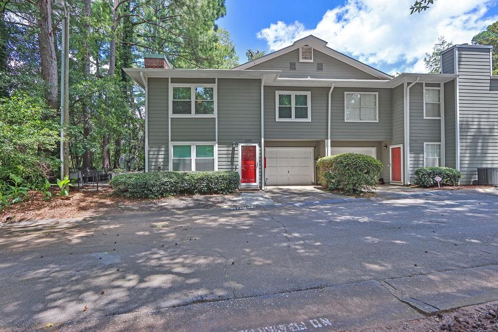 Welcome home! This beautifully updated end-unit townhome is arguably one of the nicest homes in the community. Step inside and fall in love with the open great room complete with fireplace. The fully renovated kitchen features newly painted cabinetry, quartz countertops, stainless-steel appliances and modern fixtures creating the perfect space for cooking and entertaining. Rounding out the first level is the half bath, laundry room, and one-car garage. The transformation continues upstairs to an open loft area w/laminate flooring, creating a separate space perfect for work or play. The primary suite is spacious and leads to a spa-like bath featuring a newer vanity with backsplash, tiled shower, and generous closet w/custom shelving. The secondary roommate style bedroom is also spacious and features a fully renovated ensuite bath with custom shower. The private outdoor patio is ideal for gathering/gardening and is framed by mature greenery that ensures both serenity and privacy. Located in a vibrant, friendly community just minutes from downtown Norcross and convenient access to I-85 and Lawrenceville Highway. Happy Showing!