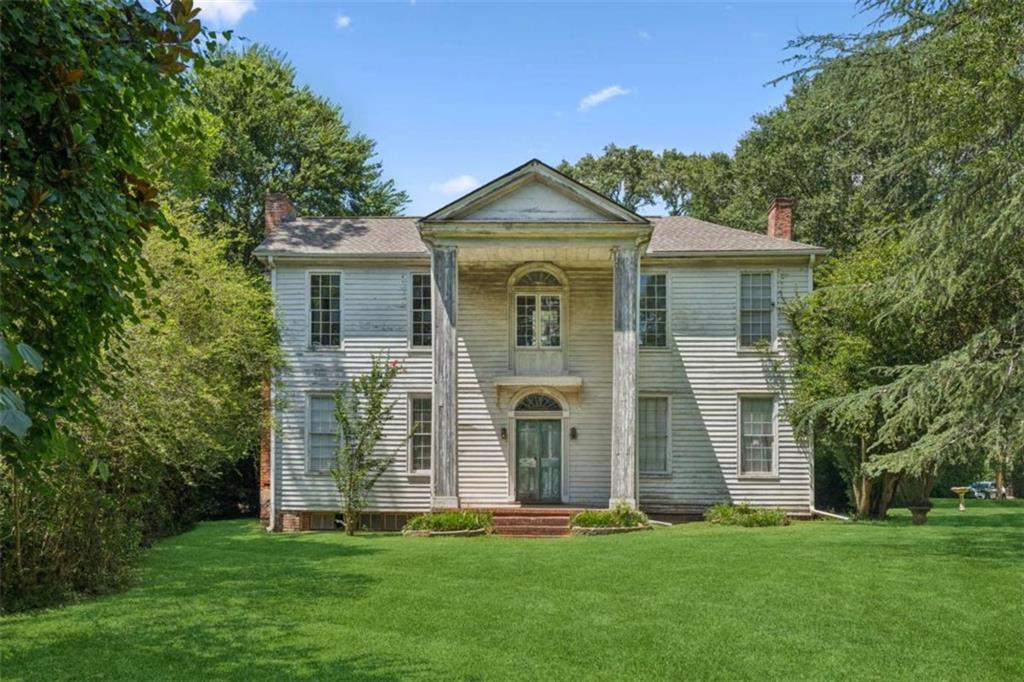 Circa 1838 Historic Masterpiece - Rare Restoration Opportunity! The Capers/Dickson/Branham House is calling. A stunning example of Southern Federal elegance, this architectural jewel offers a once-in-a-lifetime chance to breathe new life into a piece of history. Featuring a classic two-story portico, fan-lighted doors with original pilasters, and six fireplaces-including a jaw-dropping Adams-style triple sunburst mantle with bamboo-style columns-this is the kind of character you can't recreate. Original heart pine floors run throughout, and remnants of early wallpaper still grace the walls. The roof is relatively new, the structure is rock solid, and the home is just waiting for HVAC and your vision to revive its full glory. This is not a project for the casual hobbyist-but for the serious restorer or savvy investor, it's a dream ready to be realized. Whether you see a luxury forever home or a high-end flip, the potential is staggering. Act fast-properties like this don't wait. And neither should you.