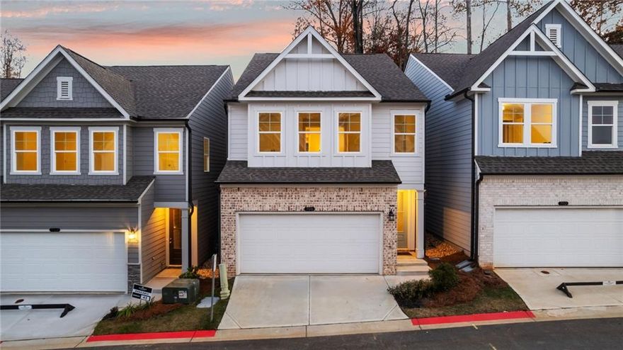 Welcome to your amazing brand-new home with 3-bedrooms, 2.5-baths and a 2-car garage located in the highly sought-after gated Village at Shallowford community. The combination of tax benefits when you close in 2025 with the end of the year incentives with Davidson Mortgage of up to $20,000 towards closing costs are a reason to celebrate your new home this holiday season! This move-in-ready home offers beautifully designed living spaces with great room sizes and a functional open floor plan. The heart of the home is the gourmet kitchen featuring a spacious island with elegant Quartz countertops, pendant lights, 42” White Shaker cabinets and a subway tile backsplash. This great space will be enjoyed by all with a new Gas range and all Stainless Steel appliances. You will love the large walk-in pantry and mudroom area next to the garage. The open-concept main level boasts 9-foot ceilings with great windows and a completely private rear courtyard - perfect for relaxing or entertaining. The cozy living room features a shiplap fireplace with easy remote control on/off features and open dining area which is ideal for your first holiday season. Upstairs, you will enjoy an open loft area for an additional sitting area or TV nook. Next you will retreat to the oversized primary suite with a tray ceiling, luxurious extended tile shower, dual vanity, and a walk-in closet. The open railing staircase, oak tread stairs and wood flooring in the loft enhance the home’s modern, airy design. Two spacious secondary bedrooms are tucked on the other side of the loft which provides versatility and privacy. The hall bath upstairs is spacious and features a double vanity with quartz countertops. Located in the only gated community in Kennesaw featuring both a pool and clubhouse, residents enjoy resort-style amenities and proximity to top-rated schools, shopping, dining, and major highways. This home is an excellent primary residence or investment opportunity. The extended warranties, high energy saving features you get with new construction and amazing end of the year incentives make this home one you do not want to miss!