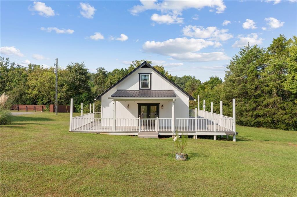 Welcome home to this charming 3-bedroom, 1.5-bath property nestled on a peaceful ¾ acre lot in Cedartown, GA. Perfect as a starter home or investment opportunity, this residence combines modern updates with classic appeal. Step inside to find new carpet upstairs, fresh vinyl windows that bring in natural light, and durable new cement siding for lasting curb appeal. The metal roof offers peace of mind, while the low-maintenance composite deck is the ideal spot to relax or entertain during cool Georgia evenings. Cedartown is known for its small-town warmth and convenient location. Just minutes away, you’ll find downtown Cedartown’s historic charm, local dining, and shopping. Outdoor enthusiasts will love being near the Silver Comet Trail, perfect for biking, jogging, or a leisurely stroll, and within easy reach of Lake Weiss for fishing and boating getaways. With quick access to Rome and the Alabama state line, this home offers both comfort and convenience. Don’t miss your chance to own this quaint Cedartown gem with updates already in place—ready for you to move in or add to your portfolio.