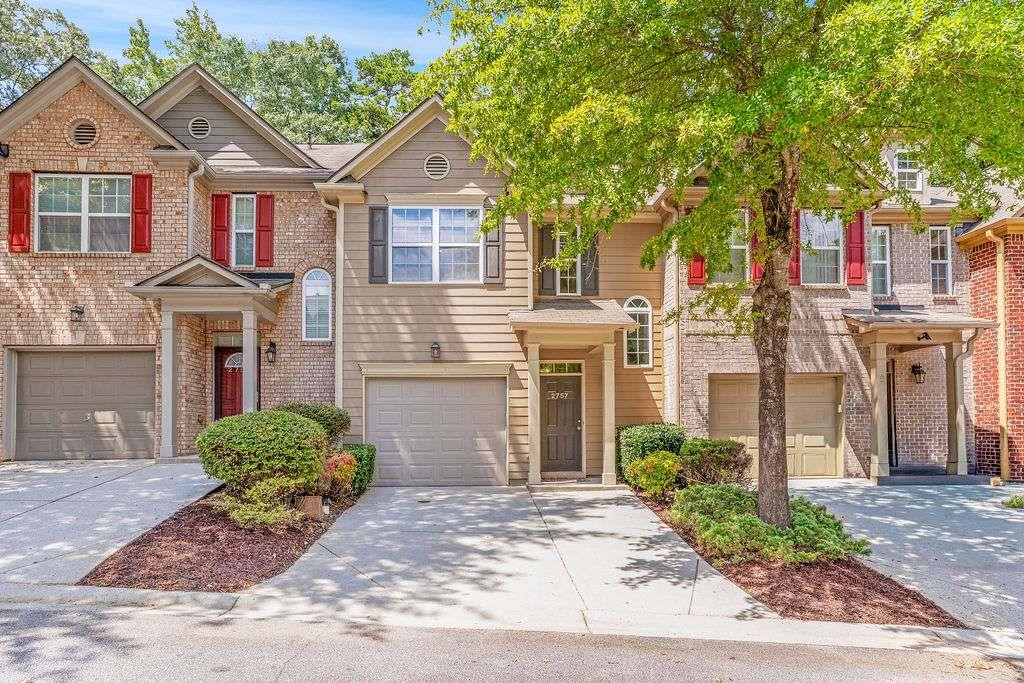 Move-In Ready Townhome with NEW PAINT - NEW CARPET & Beautiful Kitchen! Welcome to this beautifully updated 3-bedroom, 2.5-bathroom townhome in the sought-after gated community of Keystone Gates. Fresh new paint and new carpet enhance the inviting interior, beginning with a sunlit foyer that flows into luxury vinyl flooring throughout the main level. The open-concept kitchen showcases beautiful cabinets, a black appliance package, and a breakfast bar overlooking the elegant dining area and spacious family room. Step outside to the private patio with serene wooded views, perfect for relaxing or entertaining. Upstairs, the oversized primary suite offers a vaulted ceiling, large walk-in closet, and a spa-inspired bath with separate tub and shower. Two generous secondary bedrooms share a full bath, while the laundry area with washer and dryer included adds convenience. Ideally located near I-20, just minutes from shopping and dining at Stonecrest, and only 20 minutes to vibrant Intown Atlanta or Hartsfield-Jackson International Airport.
