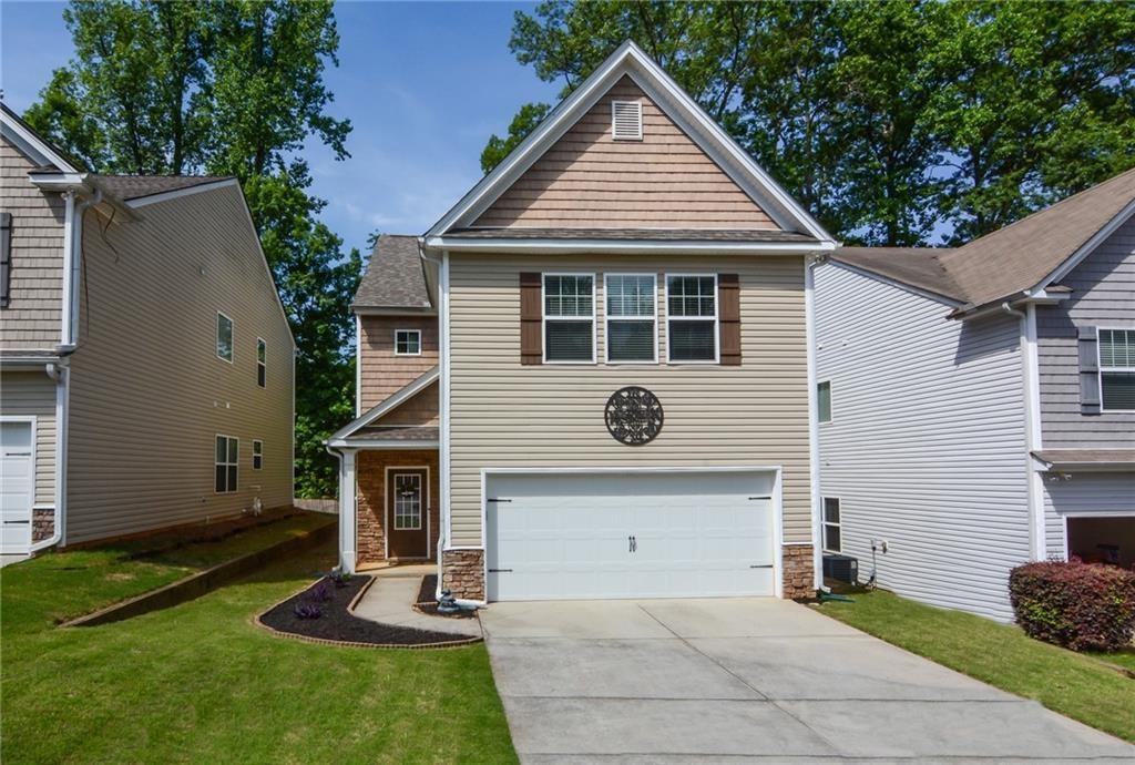 Conveniently situated in the heart of Sugar Hill with top rated Lanier High School district. This home features beautiful hardwood floors throughout the main living areas, leading seamlessly to the cozy fireside family room. The open concept floor plan is perfect for daily living, with the dining area flowing into the light-filled kitchen. The kitchen is equipped with granite countertops, stainless steel appliances, and a convenient breakfast bar for casual dining. Upstairs, the spacious Owner's suite boasts vaulted ceilings, plush carpeting, and a serene ensuite bathroom. Three additional bedrooms and another full bath complete the second level. Located across from EE Robinson Park and just a 5-minute drive from Downtown Sugar Hill, Suwanee Town center and Ashton Gardens, this home provides easy access to many nearby amenities and attractions. Applicants may apply through Zillow. Or, The owner expect tenant with decent credit score with no prior conviction/eviction history and a clean background check through a third party verification system, $50 per applicant 18 and older. A verifiable employment history needs to be provided as well as a copy of the last three pay-stubs. Must have first month of rent and security deposit ready before moving in. The tenant is responsible for all utilities as well as the maintenance of the yard work per HOA rule.