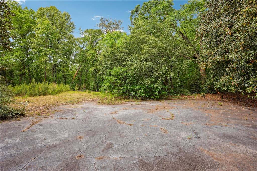 Situated in the prestigious Paces neighborhood very close to top rated school, upscale shopping, fine dining and recreational activities in Buckhead, GA. This property offers a rare opportunity to build your dream home on a sprawling 4.46 acre lot. Surrounded by estate properties and beautifully wooded large lots, the property provides a private setting for a residence with over 400 feet wide. The lot is ready for construction, with house plans designed by renowned architect Rodolfo Castro and building permits approved. These plans are tailored to complement the long drive to the build site at the hilltop with magnificent views of treetops and serene environment. This exceptional property with tranquil surroundings presents a great opportunity to create a peaceful retreat in the heart of Buckhead.