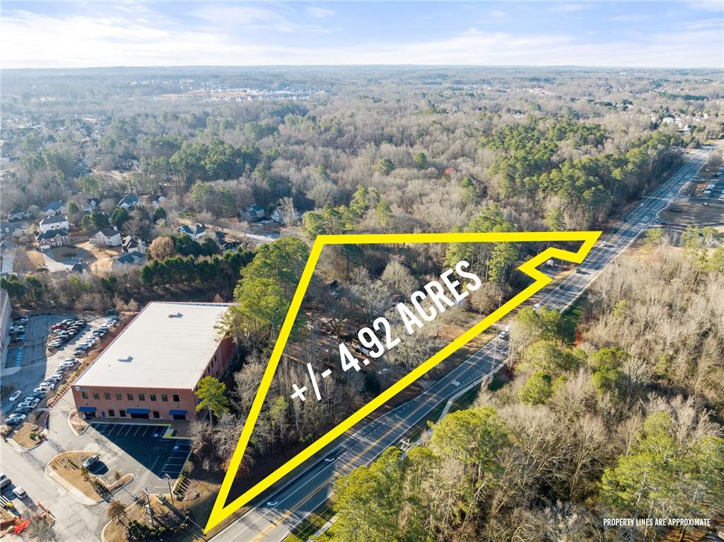 A 4-parcel assemblage totaling 4.915 +/- Acres of land located on the Southeast side of Post Road South of Majors Road. 6107-6139 Post Road. Zoned CBD (Commercial Business District) Land is located next to One Life Fitness in Vickery Village.