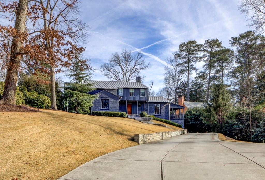 A stunning renovation on one of Buckhead’s most prestigious streets. Totally transformed in 2017 from its original 1939 design by architect Steve Fintak, designer Lee Kleinhelter, and landscape architect Carson McIlheney, the home has become a Peachtree Heights West landmark known for its unique style and simplistic character.  With a perfect blend of contemporary and traditional, the home can easily adapt to either. The kitchen and all bathrooms are renovated to perfection with the latest in quality finishes, and the living spaces are casual, yet sophisticated, with plenty of wall spaces to display an art collection. Two open-air porches off the living room, dining room, and kitchen offer outdoor relaxation and easy entertaining. The flat, walk-out, conveniently turfed backyard has a putting green, a storage shed, and plenty of room for a future pool.  A beautifully restored driveway leads to two back-facing garages with a cemented area for additional parking and plenty of turn-around space.  Located in the Morris Brandon Elementary School district, near private schools, and a short distance from the Governor’s Mansion, Cherokee Country Club, and the Atlanta History Center.
