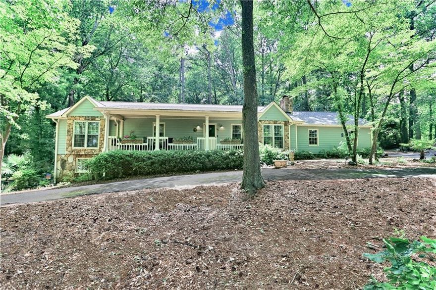 Opportunities like this rarely come along — a beautifully updated, spacious ranch with a fully finished daylight basement, nestled on a private one-acre lot in the heart of East Cobb. Perfectly located just minutes from top-rated schools, shopping, dining, and major highways, this home offers the ideal blend of comfort, flexibility, and convenience. Boasting 5 bedrooms and 3 full bathrooms, the bright and open floorplan is filled with natural light and features gleaming hardwood floors throughout the main level. Designed for everyday living and effortless entertaining, the layout provides multiple gathering spaces, indoors and out. Enjoy peaceful mornings and relaxing evenings on the newly added screened porch with metal roof, making it the perfect outdoor retreat - or greet guests on the inviting, covered front porch with classic Southern charm. The property also includes a 2-car garage with new doors, a circular driveway for added parking and convenience, a full-length attic with custom shelving for exceptional storage, and a versitile outbuilding ideal for a workshop, studio, or she-shed. The full, finished basement is sure to impress, adding two bedrooms, a full bath, a large bonus/living room, an office or media room, a kitchenette with a second laundry connection, and a private entrance with its own driveway — perfect for multigenerational living, or income potential. Located in an award-winning Cobb County school district, this home checks every box for space, function, and lifestyle. Don’t miss your chance to own a truly special property in one of East Cobb’s most desirable areas—schedule your showing today!