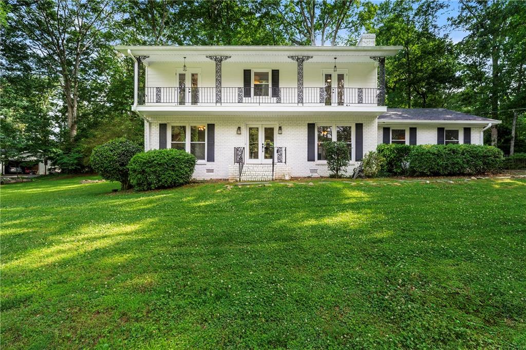 Step inside this beautifully updated East Cobb home in Chattahoochee Heights—where comfort, flexibility, and top-rated schools come together on a spacious 0.61-acre lot with no HOA restrictions. This 4-bedroom, 3.5-bath residence offers 2,326 sq ft of thoughtfully designed living space, including a versatile 20x20 bonus room with a full bath—ideal for a home office, guest suite, or playroom. (Please note: the garage has been converted, so there is no garage or carport.)
Enjoy mornings on your private balcony overlooking the front yard, afternoons in the large fenced backyard, and evenings entertaining on the patio. Outdoor enthusiasts will appreciate nearby Hyde Farm, scenic Chattahoochee River trails, Azalea Park, and the Chattahoochee Nature Center. Everyday conveniences like Kroger, Whole Foods, and a variety of shopping and dining options are just minutes away. Zoned for some of East Cobb’s most desirable schools—Mount Bethel Elementary, Dickerson Middle, and Walton High—this property is the perfect place to grow and thrive. Discover a home that offers the space, location, and lifestyle you’ve been searching for.