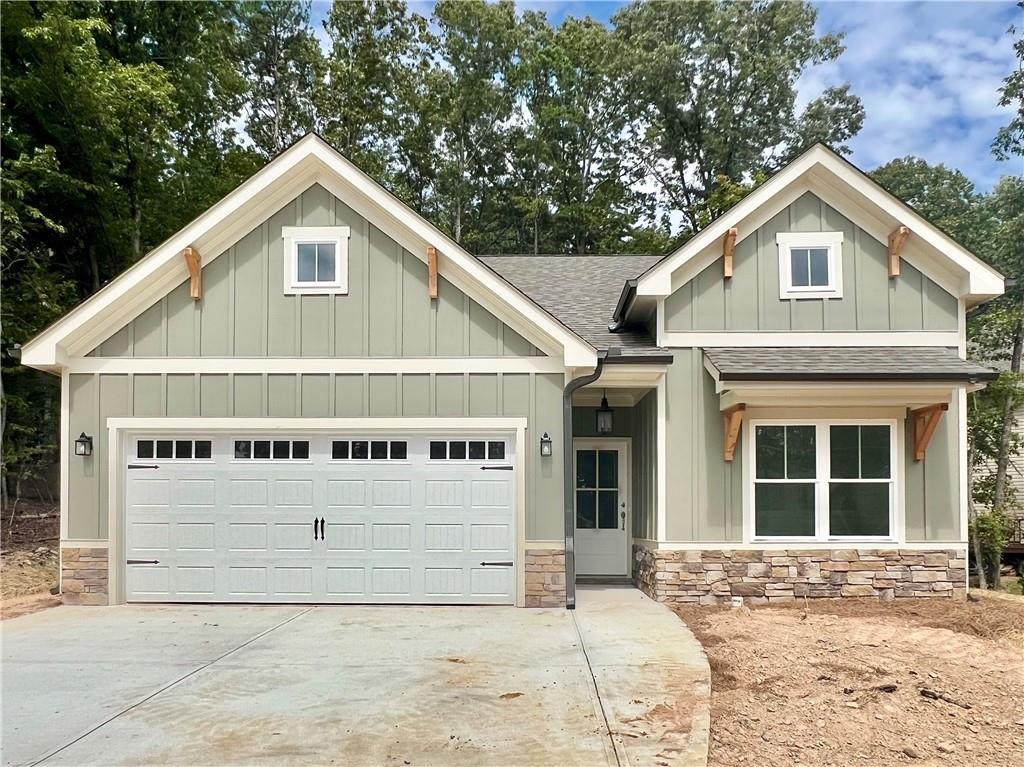 Great True Ranch Plan with Charming Covered Front Porch with 3 Bedrooms 2 Bath Open Floor Plan, Rear Covered Deck with Beautiful Wooded Mountain Views, Gourmet Kitchen with Granite Counters and Loads of Cabinet Space. Private Master Suite with Double Vanity, Walk In Closet and Spacious Shower. Ready December 2025. Come out and see why Lake Arrowhead has been voted TOP BEST 100 PLACES TO LIVE.