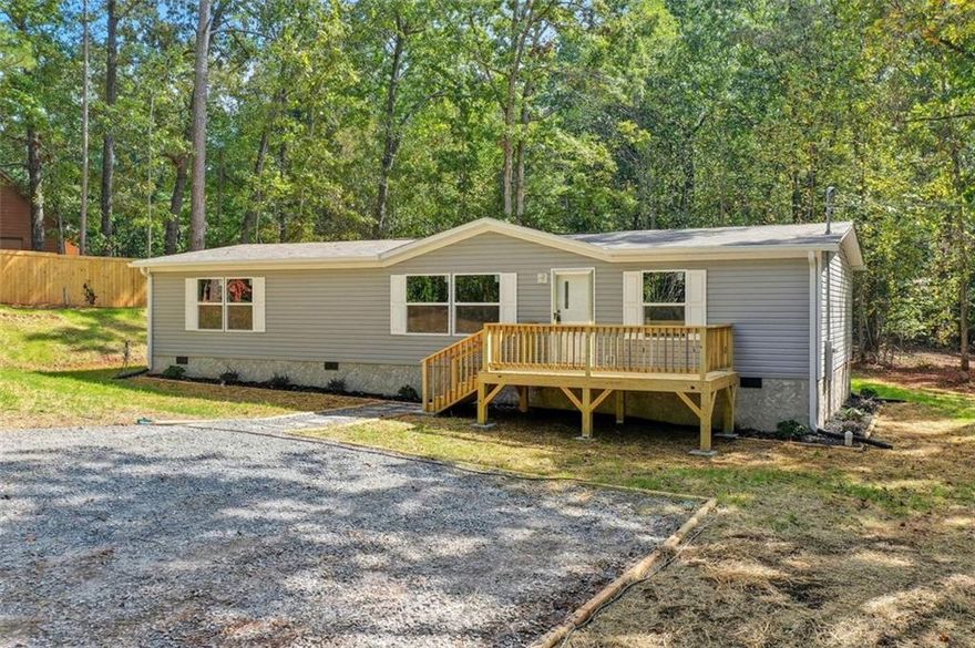 Brand new mobile home on 2 acres permanent foundation. Spacious front and back decks, new appliances included. Beautiful location. Great landscaped yard. A must see.