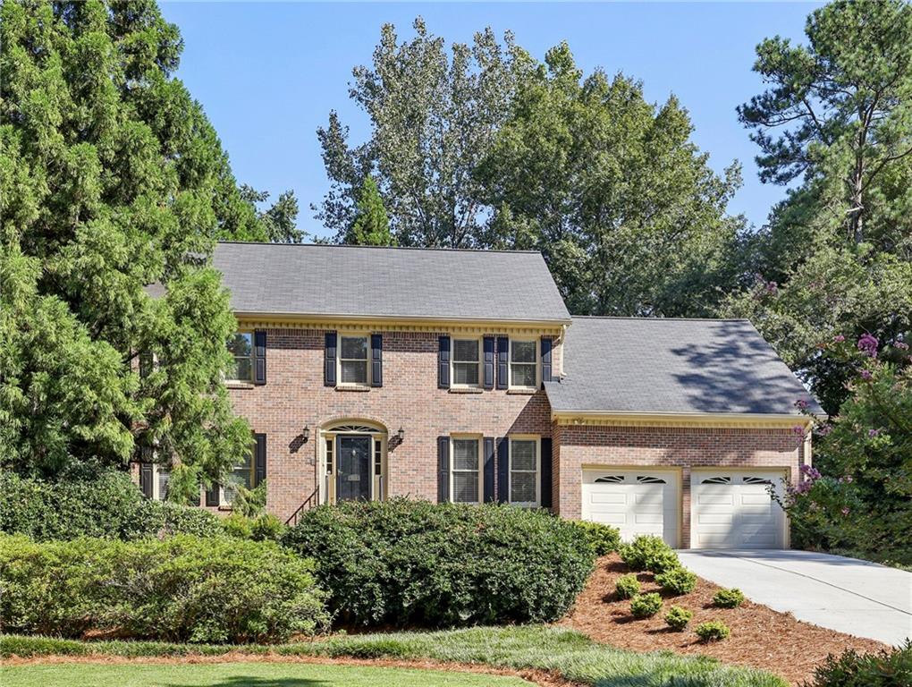 Beautiful, move-in ready home in the highly sought-after, East Cobb swim/tennis neighborhood of Somerset. This spacious, 6-bedroom, 4-bath home is ideal for comfortable family living and entertaining. Enjoy natural light throughout, complemented by a neutral color palette with new flooring, carpet and paint as well as two updated kitchens. This wonderful home boasts a large, separate dining room, eat-in kitchen with white cabinetry, double ovens, mounted microwave, electric cooktop, pantry and adjacent laundry room. Also on the main level is a cozy bistro space off the kitchen, a lovely great room with stone, gas fireplace, wood beam ceiling and dual built-in bookcases. Adjacent to the great room is a large sun room with massive windows, overlooking the serene backyard. The main level also features an office/bedroom and full bath. Upstairs, enjoy the expansive owner’s suite with walk-in closet, sitting area and ensuite full bath with bidet and dual sink vanity. Two additional bedrooms, a full hallway bath and large media/recreation room complete the upper level. The finished basement offers a spacious family room with kitchen, a full bath and a versatile bedroom/office and laundry. Step outside and enjoy your own backyard, professionally landscaped, oasis/sanctuary featuring an inground, saltwater pool with beautiful waterfall, all easily controlled on your phone. Relax in an 8-person hot tub or wander along stone pathways to enjoy a private, garden gazebo or 2-person swing. Mature trees, including evergreens, provide privacy and tranquility. Multiple rear deck areas and a large patio make this space perfect for entertaining. The outdoor kitchen includes a large serving area surrounding a built-in gas grill. Located in a top-ranked school district, the Somerset community offers exceptional amenities, including a clubhouse, competition-sized pool with swim lanes and diving board, two tennis courts and Turtle Lake for fishing and non-motorized boating. Conveniently close to major highways, East Cobb Avenue, The Battery, excellent dining and parks. Vacant and move-in ready to decorate for the holidays.
