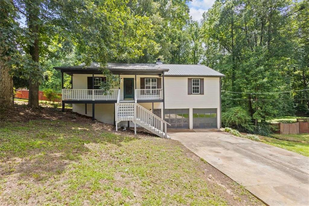 Updated 3BR/2BA Ranch with Bonus Room in Prime Douglasville Location! Welcome to 6441 Michell Way - a move-in ready 3-bedroom, 2-bath home featuring fresh paint, brand-new luxury vinyl plank flooring, and a flexible layout perfect for modern living. In addition to the main-level bedrooms and living areas, this home includes a finished bonus room located off the basement/garage - ideal for a home office, guest space, playroom, or media room. New LVP flooring and fresh paint throughout 3 spacious bedrooms and 2 full bathrooms ? Finished bonus room in basement/garage area Full basement with room to expand further Quiet, established neighborhood with easy access to I-20, shops, and restaurants This property is being sold as-is. Schedule your showing today and explore the potential of this well-located Douglasville home!