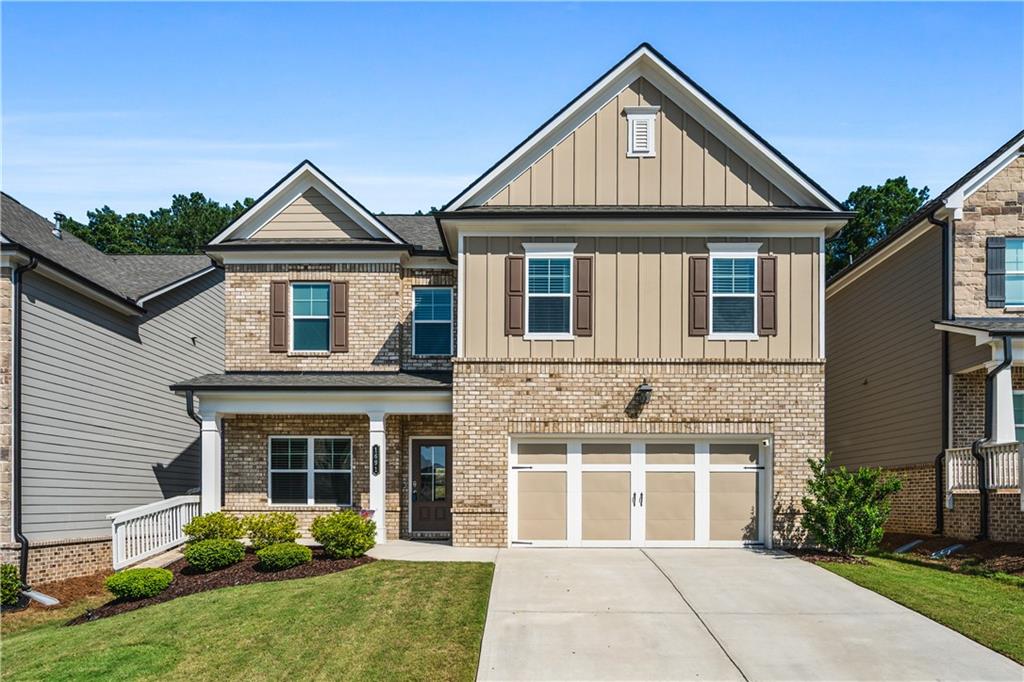 Welcome to this beautifully maintained, like-new home built in 2022, offering 4 spacious bedrooms, 2.5 baths, and a thoughtfully designed floor plan perfect for modern living. From the moment you step inside, you’ll notice the quality craftsmanship and stylish finishes that make this home truly stand out. The heart of the home is the extended gourmet kitchen, featuring stunning granite countertops, a 5-burner gas cooktop, built-in wall oven and microwave, and abundant cabinet space for all your storage needs. The open-concept layout flows seamlessly into the family room, where a striking stacked stone fireplace and coffered ceilings create a warm and inviting space to relax or entertain. Hardwood-style flooring flows throughout the main level, upper hallway, and into the luxurious primary suite. The front flex room offers versatility—ideal for a formal dining room, home office, or creative space. Upstairs, the generous primary suite is a true retreat, complete with a large walk-in closet and a bright, airy bathroom featuring dual vanities and an oversized tiled shower. The laundry room is conveniently located on the second floor for easy access. Enjoy outdoor living year-round on the screened-in patio overlooking the fenced backyard—perfect for entertaining, pets, or play. Additional features include smart home technology and a 2-car garage. Ideally situated near top-rated schools, shopping, and dining, this home combines comfort, convenience, and style in one exceptional package.
