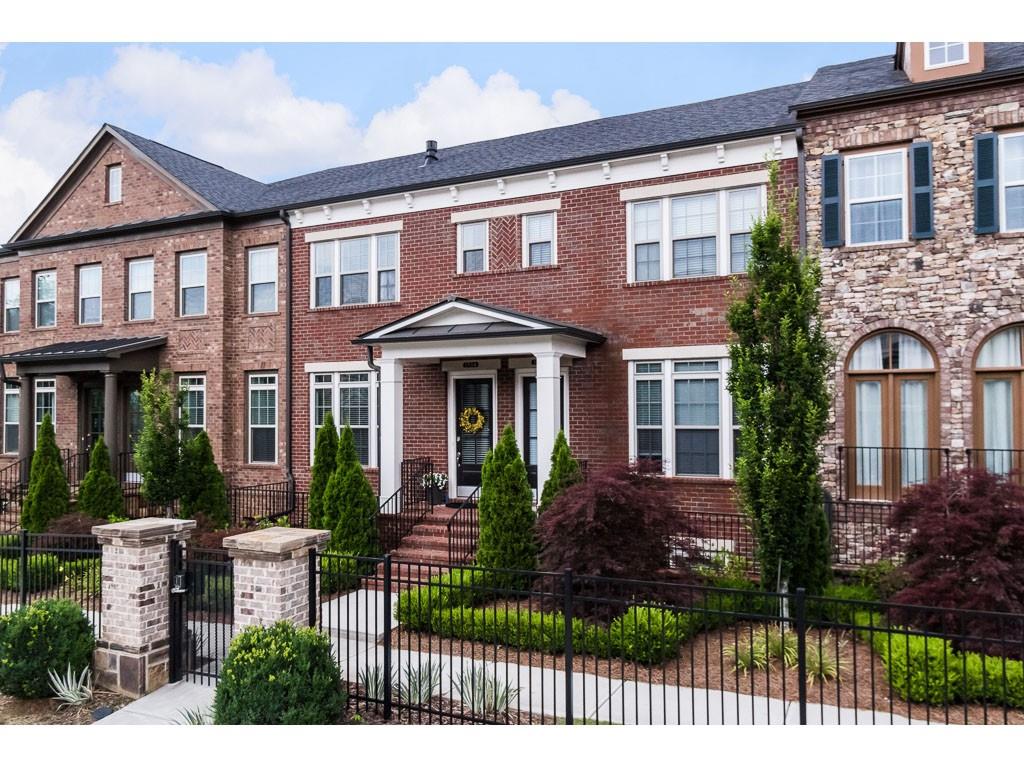 Upgrades GALORE! This 4yr old, masterfully designed & maintained brick townhome located in the best Brookhaven location! Custom finished, soaring ceil, hrdwds thru-out, exposed beams, brick accent walls, new lighting, & custom cable railing. Liv rm designed w/linear 5’ fplc & floating shelves. Chef’s KIT: granite, ss appl, 2 bfst bars, LG isl, underlit cab. Sizeable Din Rm w/access to bk deck. Spacious Bedrms incl LUX MSTR w/trey ceil & true spa-bath: stunning tile, oversz shower w/rain fix & river rock flr, plus custom walk-in clst. 2-car garage. Resort pool & LG Park!