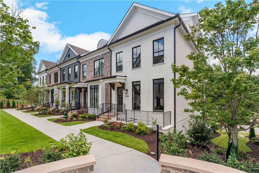 Welcome home to this beautiful community in the Heart of Downtown Alpharetta! This elevated luxurious residence sits on the community mews offering you a quaint atmosphere while being so close to everything